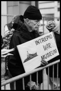 Dan Berrigan protesting the rededication of the Intrepid war museum aircraft carrier on the west side of Manhattan, Nov. 2008. Photo: Ed Hedemann