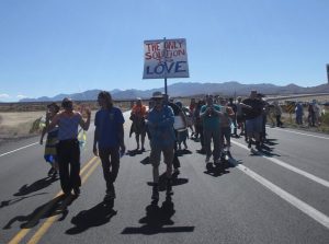 Catholic Workers process to the gate of the Nevada National Security Site (nuclear test site), photo by Felice Cohen-Joppa