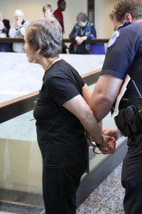 One of four drone protesters being arrested. Photo by Ted Majdosz