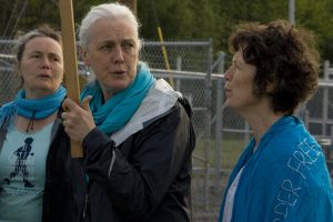 The Grady sisters, (L-R) Ellen, Teresa and Clare, protest in Seneca Lake. (Photo: Nicholas Kusnetz)