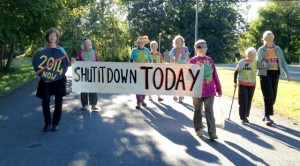 Shut It Downers advance to the Vermont Yankee gate: from left - Ulrike Von Moltke, Paki Wieland, Nancy First, Hattie Nestel, Linda Pon Owens, Ellen Graves, Anneke Corbett and Frances Crowe. Photo by Marcia Gagliardi